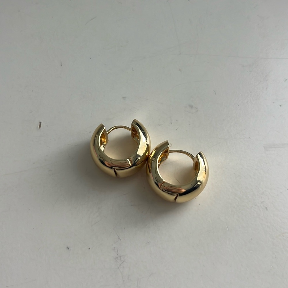 Thick gold huggie hoop earrings